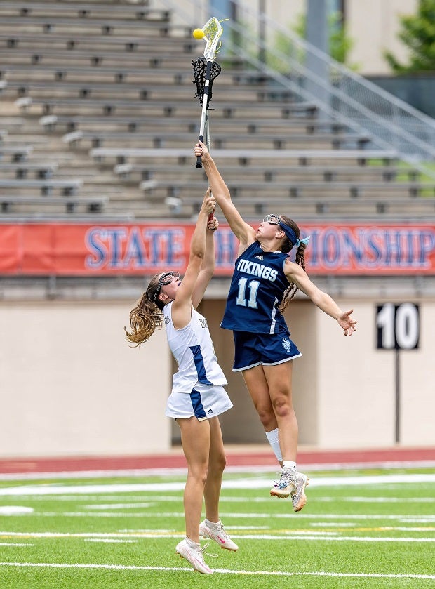 Union Pine freshman Ellie Powell goes up high in the Vikings' championship win over Bishop McGuinness. (Photo: Jason Jackson)