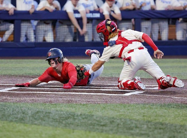 Arlington Martin’s Bryson Bentley beats the tag at the plate by Pearce catcher Nathan Berry during an Martin's playoff game against Pearce. (Photo: Robbie Rakestraw)