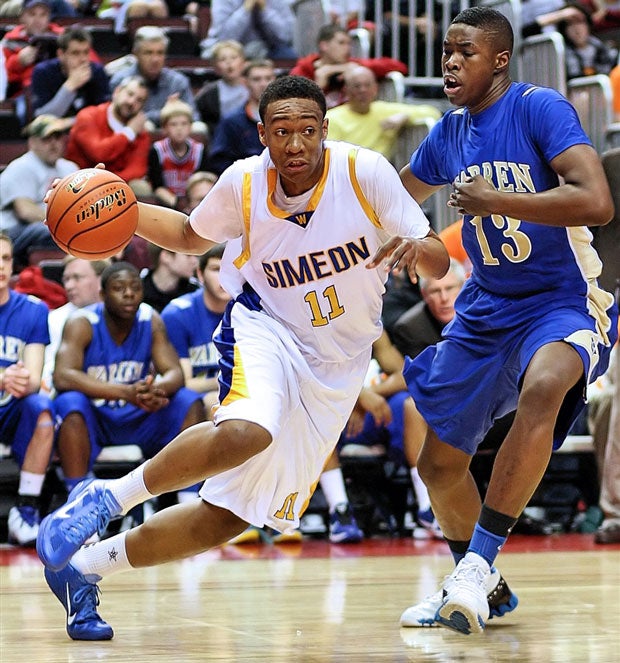 Parker drives by Warren star Darius Paul, now at Western Michigan, in the 2011 4A championship game.