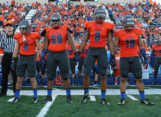 Bishop Gorman captains (left to right) Nicco Fertitta, Jackson Perry, Alize Jones and Nela Otukolo prepare for the opening coin toss.