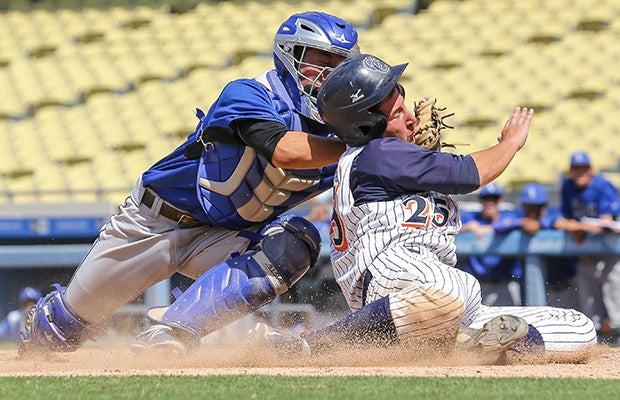 El Camino Real (Calif.) catcher Eric Yang tags out Daniel Zakosek of Chatsworth to prevent the tying run during the Los Angeles City Section Division 1 title game at Dodger Stadium.