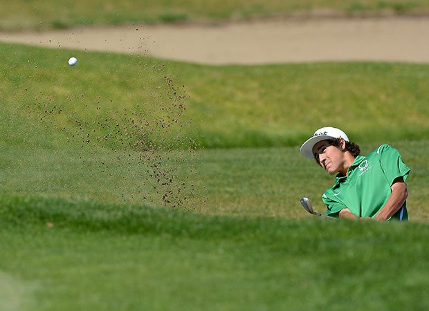 Dean Bottini of St. Mary's-Stockton (Calif.) hits a shot out of a sandtrap on the eighth hole during the Sac-Joaquin Section Masters Golf Championships.