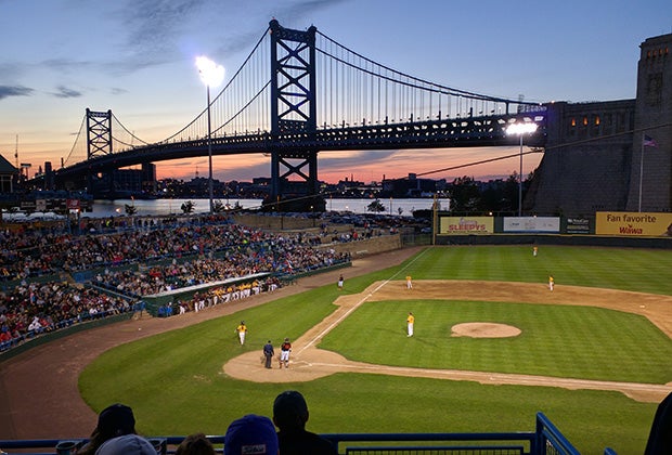 The Ben Franklin Bridge towers over Campbell Field in Camden (N.J.) during a baseball game between Barnegat and Gloucester Catholic high schools.