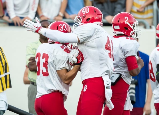 Easton Seidl (40) congratulates a teammate last season.