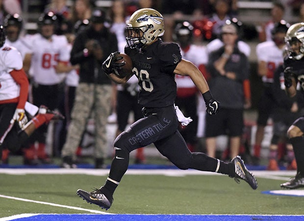 St. John Bosco running back George Holani had four touchdowns in the victory over Centennial on Friday night.