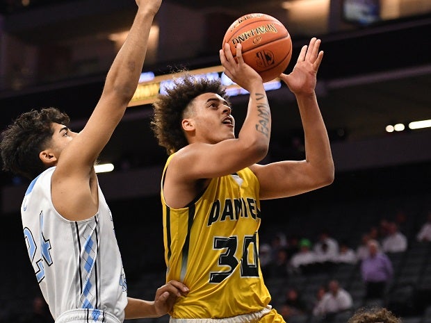 Damien's Kaleb Smith goes up for two of his 23 points in the Spartans' 65-57 win over Clovis North.