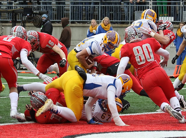 Marion Local quarterback Duane Leugers caps off a 99-yard drive with a 1-yard touchdown run on fourth-and-goal.