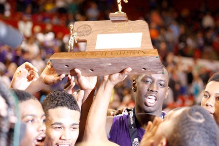 Nebraska prep basketball fans should be used to this sight: Omaha Central hoists its third-straight title trophy.