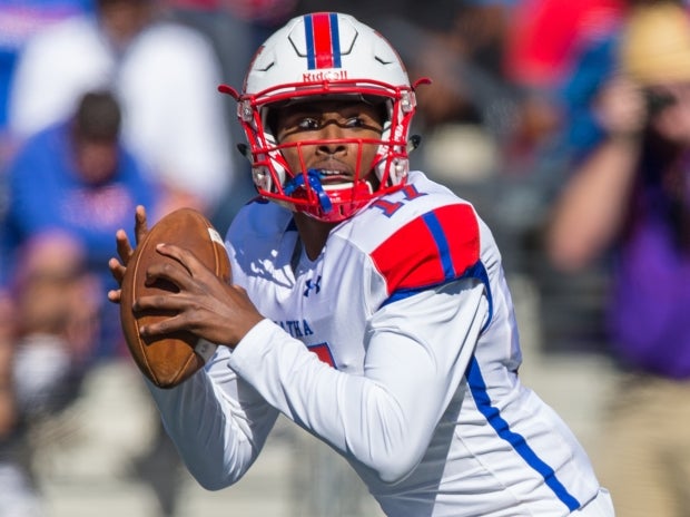 DeMatha quarterback Beau English looks downfield during an October game.