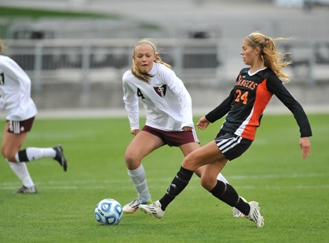Lewis-Palmer's Brianna Alger, right, has the Rangers atop the Class 4A girls soccer rankings. The junior has totaled 56 points this season (23 goals, 10 assists).