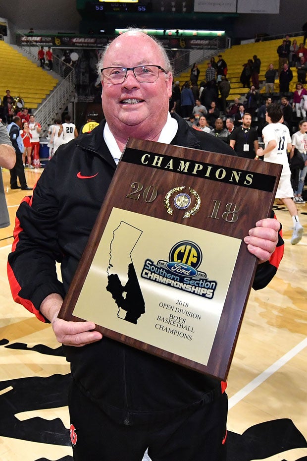 Mater Dei coach Gary McKnight with more hardware.