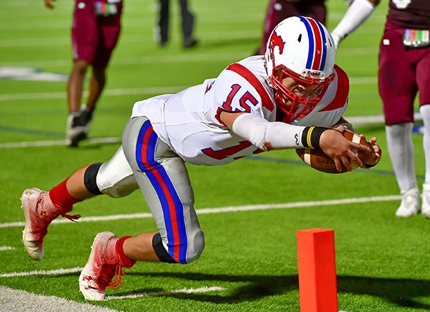 A Jefferson (Texas) player dives into the end zone for a touchdown against Highlands.    