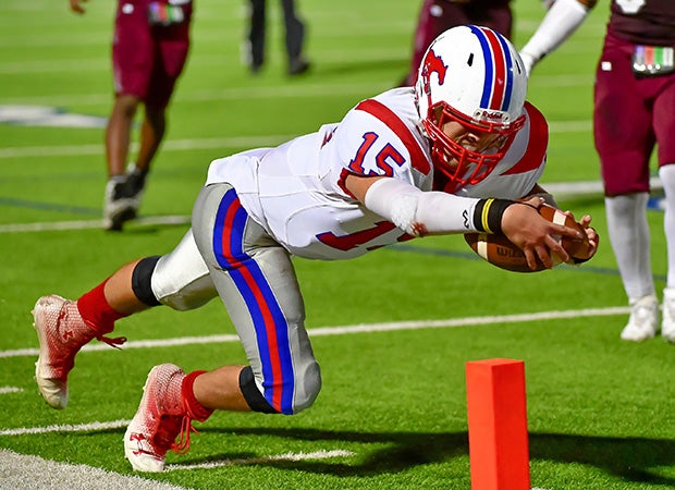 A Jefferson (Texas) player dives into the end zone for a touchdown against Highlands.