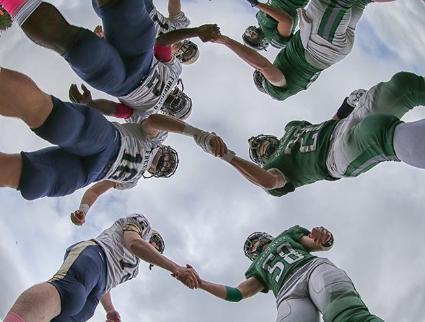 Freehold Boro (N.J.) and Colts Neck players shake hands before the coin toss.