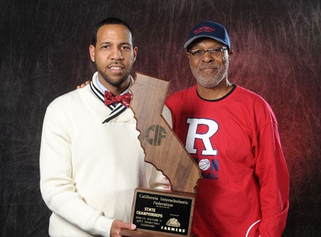 Reggie Morris Jr., left, and his father Reggie Morris Sr. are the only father-son pair to win California basketball state titles.