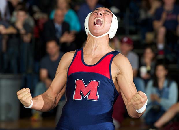 A MacArthur (N.Y.) wrestler celebrates after winning his match during a dual against visiting Mepham in January.