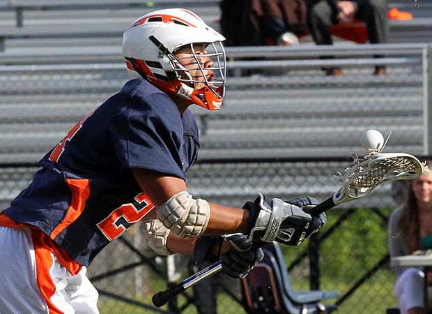 A West Springfield (Va.) player bounces the ball on his lacrosse stick during a game against host Lake Braddock in May.