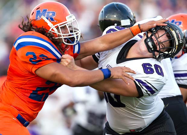 A Marvin Ridge (N.C.) defender squares off with an Ardrey Kell lineman during a football game last August.