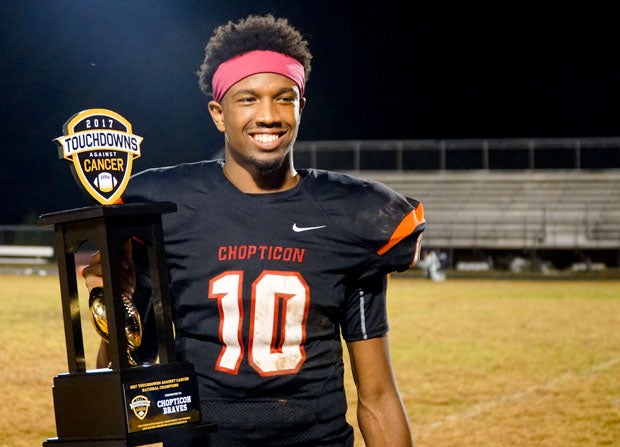 Chopticon starting quarterback Anthony Hunt posing with the 2017 Touchdowns Against Champions National Champions trophy.
