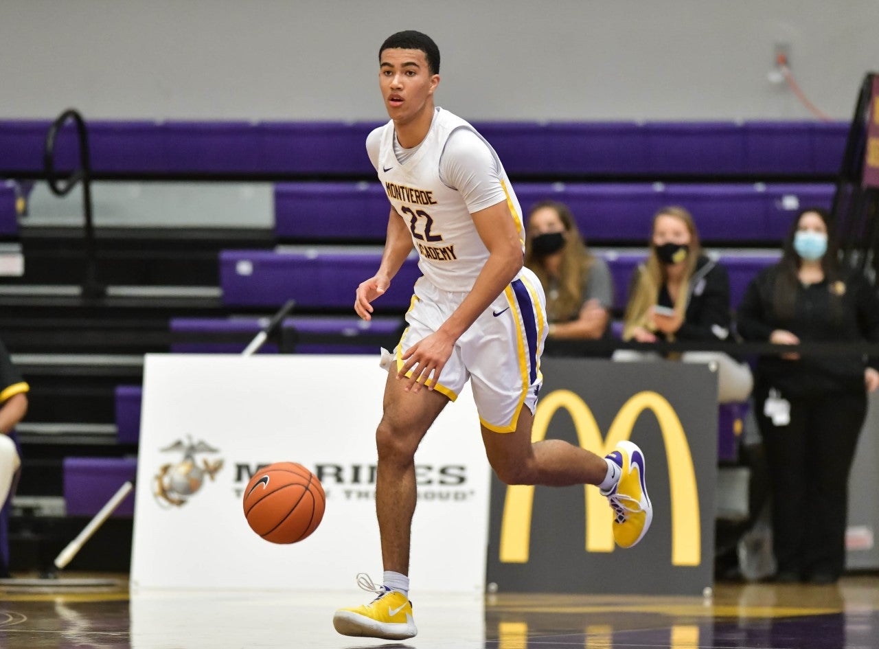 Senior Michigan signee Caleb Houstan brings the ball up the court for the Eagles.
