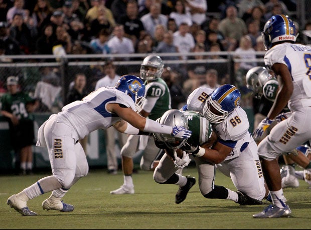 Serra's Antonio Mafi makes a tackle against De La Salle