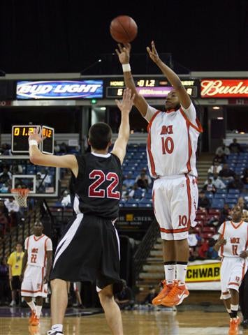 Standley connects on 3-pointer under heavy pressure.