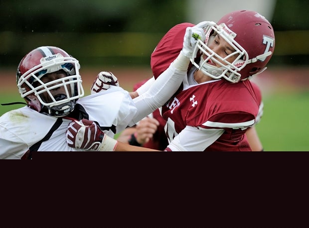 Richard Lopez of Salisbury School (Conn.) fights off a Taft (Watertown, Conn.) defender.