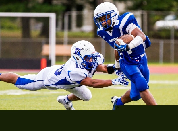 Jordon Bell of Hall (West Hartford, Conn.) escapes a Glastonbury (Conn.) defender.