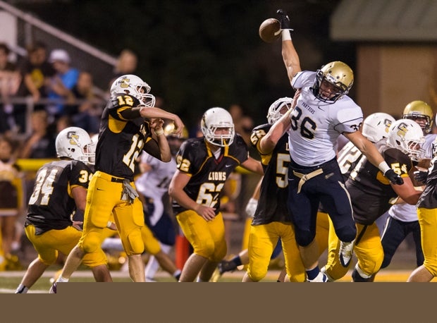 Kevin Slezak of Franklin Regional (Murrysville, Pa.) bats down a pass by the Greensburg Salem (Greensburg, Pa.) quarterback.