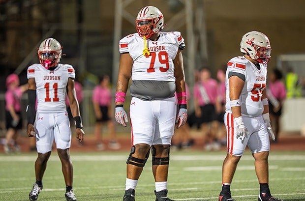 Converse Judson sophomore Jai'Storm Knight towers over teammates Dominique Davis Jr. (left, 5-foot-10, 170 pounds) and Brandon Rocha (5-10, 273). (PHOTO: Alex Garza)