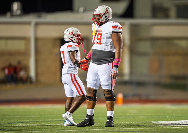 Jai'Storm Knight and Converse Judson teammate A.K. Davis share a low five during a game last week against Cibolo Steele. (PHOTO: Alex Garza)