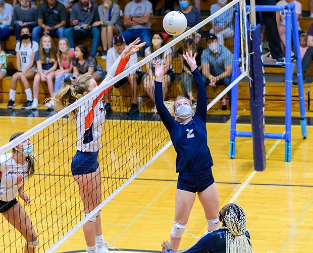 Out-of-Door Academy's (Fla.) Ansley White sets a ball for a teammate during a junior varsity match against Bradenton Christian.