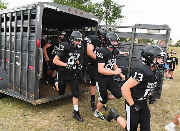 New Salem/Glen Ullin players break out of a cattle carrier before their road game against Standing Rock/Selfridge in North Dakota.