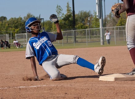 Star Sierra outfielder Iyana Hughes slides into third with a triple. 