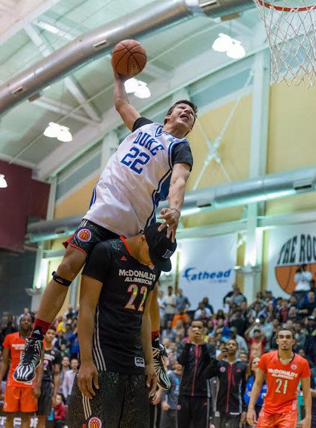 Grayson Allen takes off over future Duke teammate Jahlil Okafor.