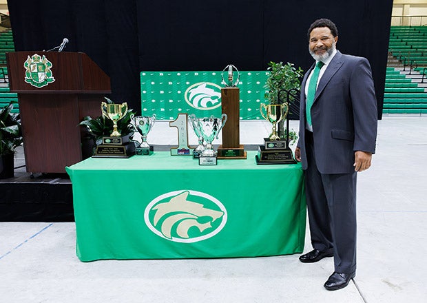 Buford head coach Bryant Appling displays the spoils of his team's national championship campaign. (PHOTO: Ken Ortloff)