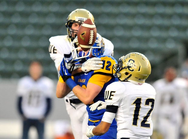 Central Catholic's secondary lays a big hit on Bakersfield Christian receiver Hayden Kuchta. 
