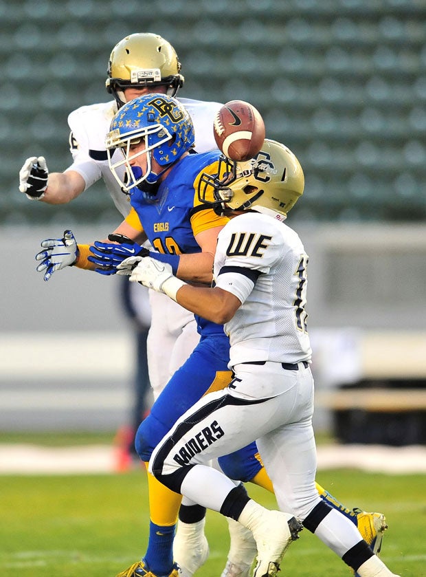 Bakersfield Christian receiver Hayden Kuchta is dislodged from football. 