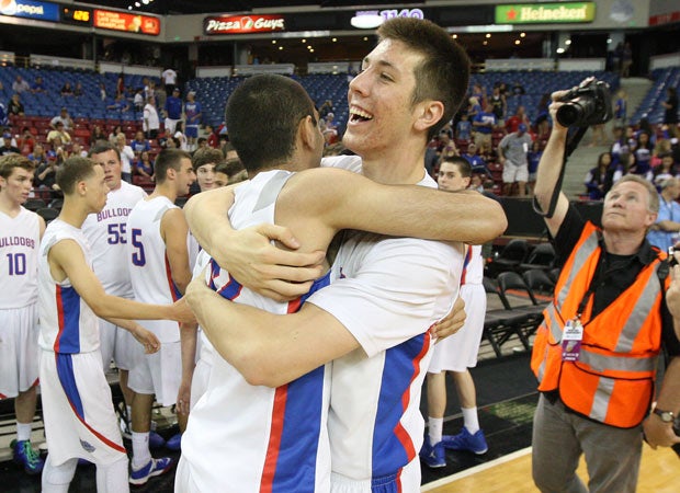 Pardis Vakili (left) and Colin Russell embrace as Folsom celebrates its second-ever Northern California championship, a 68-51 D2 win over Cosumnes Oaks.