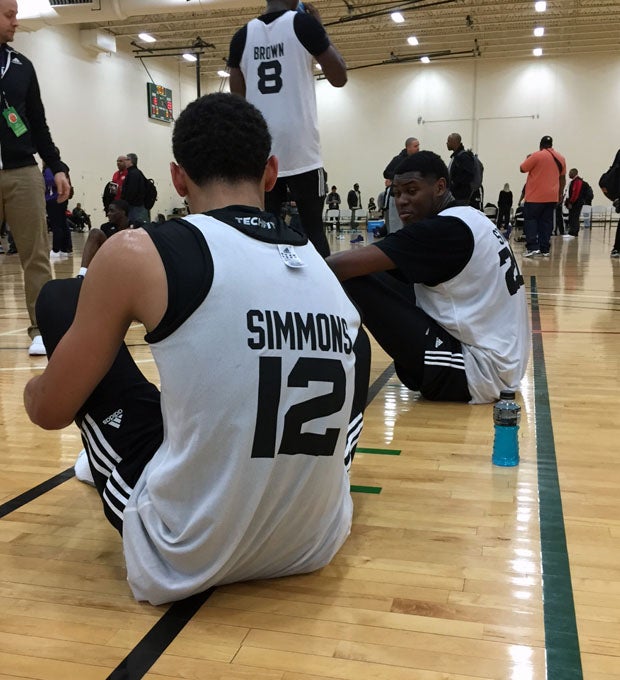 Ben Simmons and Diamond Stone stretch after the East practice.