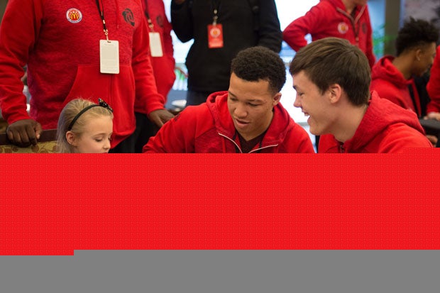 Jalen Brunson and Stephen Zimmerman spend time with a special young lady.