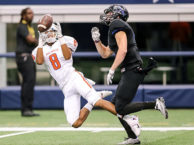 Marcel Leak of San Angelo Central (Texas) dives while attempting to make a catch against Byron Nelson (Trophy Club, Texas).