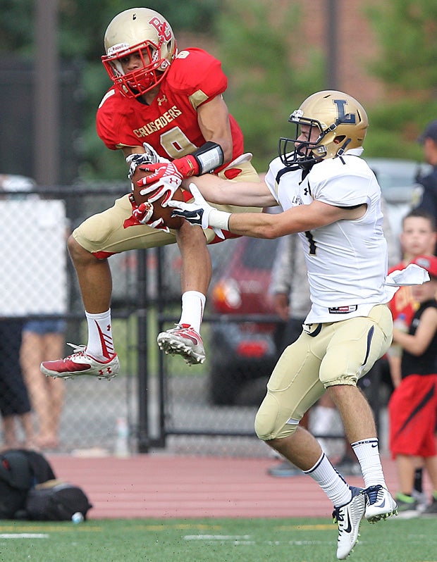 Gene Coleman of Bergen Catholic (Oradell, N.J.) leaps for the ball against a La Salle College (Wyndmoor, Pa.) defender.