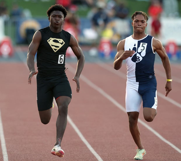 Rodrick Pleasant (left) en route to his 100-meter title in 10.30 seconds. Sophomore Jordan Washington, of Long Beach Jordan, finished second in 10.44.   