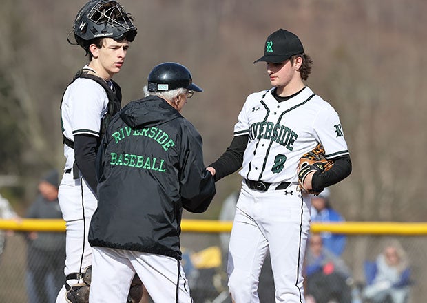 Legendary Riverside coach Dan Oliastro visits the mound during a March victory over Ellwood City. Oliastro has led the program for 55 years. (Photo: Mary Perry)