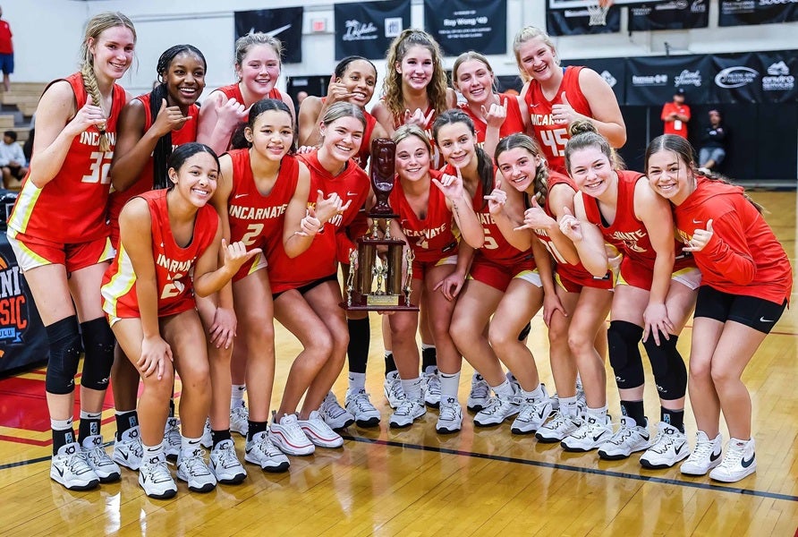 Incarnate Word Academy of Missouri celebrates after winning a tournament in title in Hawaii in 2022. The Red Knights now lead the list of 228 schools who have finished in the MaxPreps Top 25 final rankings since 2009. Incarnate Word has 10 Top 25 finishes, passing girls basketball heavyweights Duncanville and Mater Dei, each with nine. (FILE PHOTO: Brian Bautista)