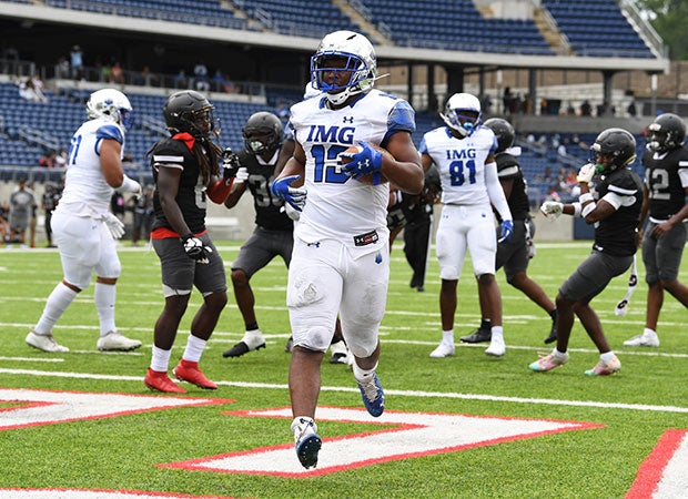 Running back Kaytron Allen scores one of his two rushing touchdowns for IMG.
