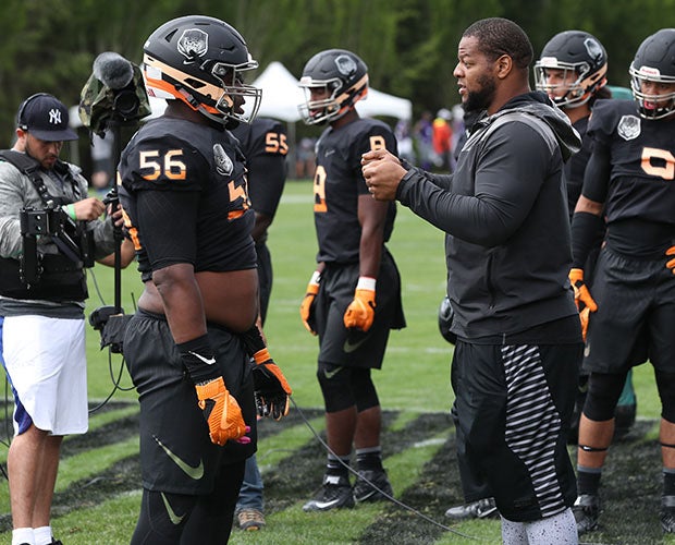 NFL standout Ndamukong Suh instructs Greg Rogers during lineman drills Saturday at The Opening.