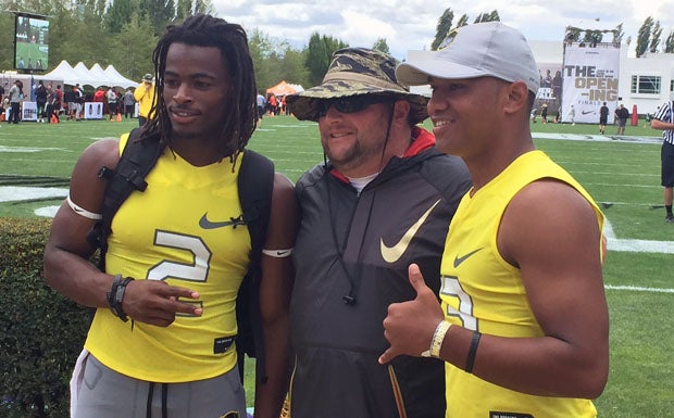 Vapor Speed running back Najee Harris (left) and quarterback Tua Tagovailoa (right), future Alabama teammates, pose with a coach at Saturday's The Opening finals in Beaverton, Ore. 