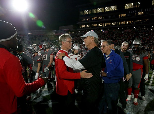 Central coach Patrick Nix (left) and Thompson coach Mark Freeman shake after Wednesday's 7A championship game at Protective Stadium. 